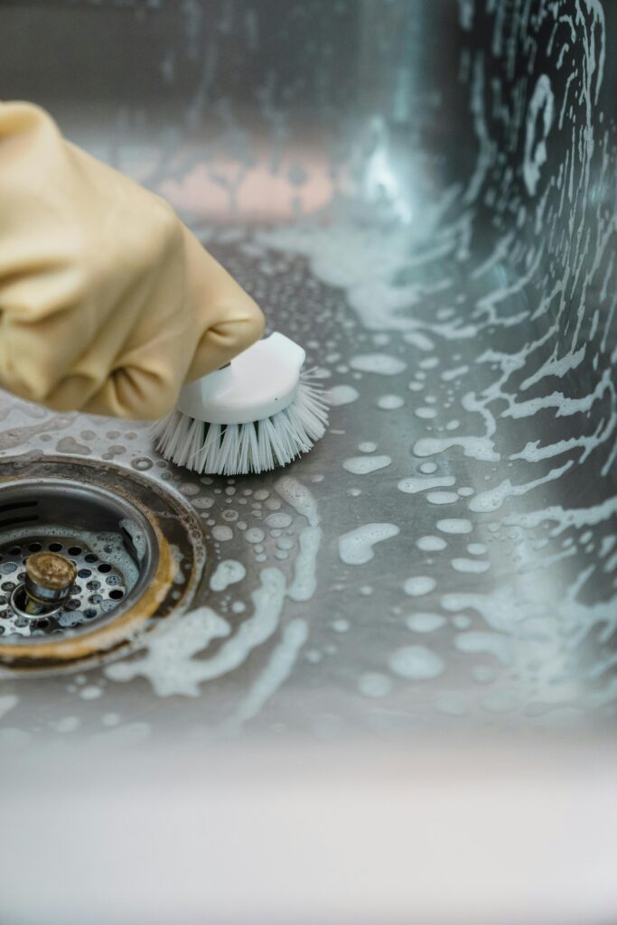 scrubbing a kitchen sink